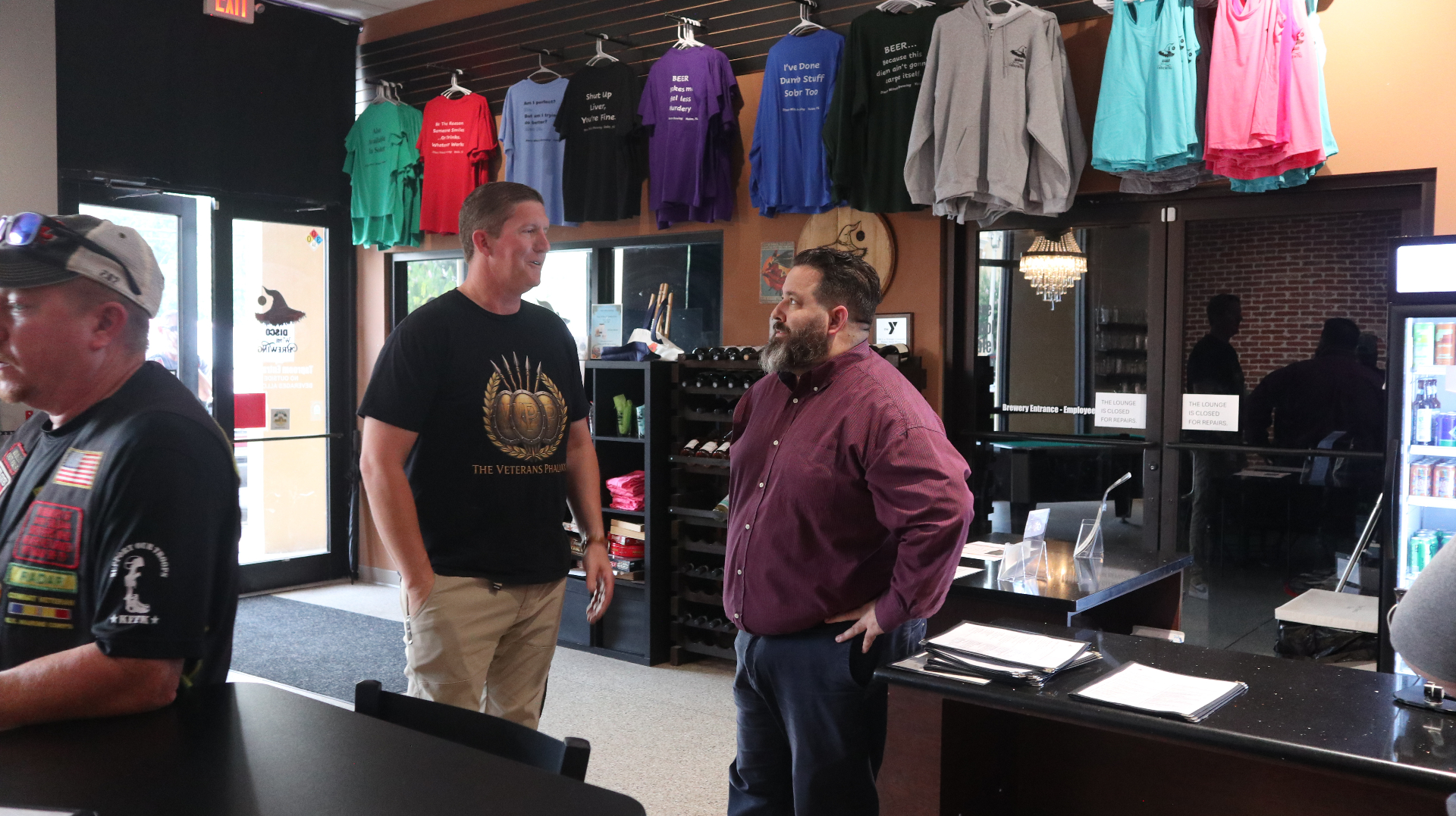 The Veterans Phalanx Founder and Executive Director speaking with a community member at Disco Witch Brewing.