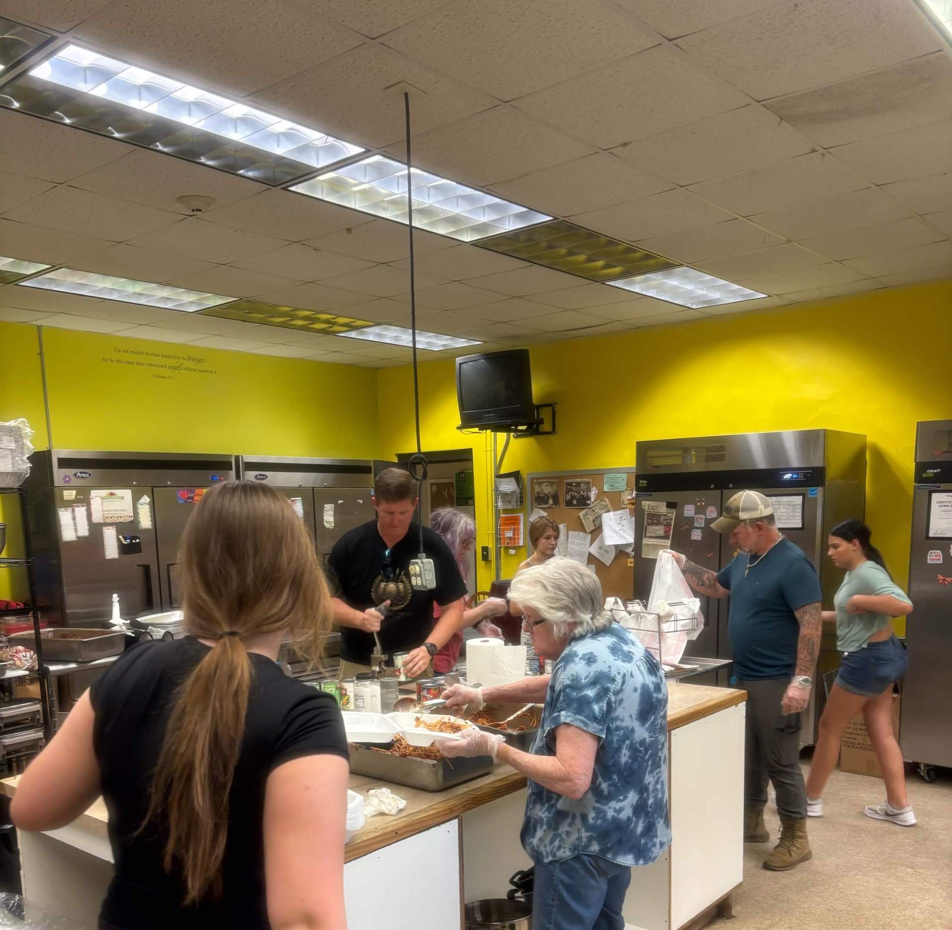 Team Mess Hall volunteers preparing meals at Gracie's Kitchen.