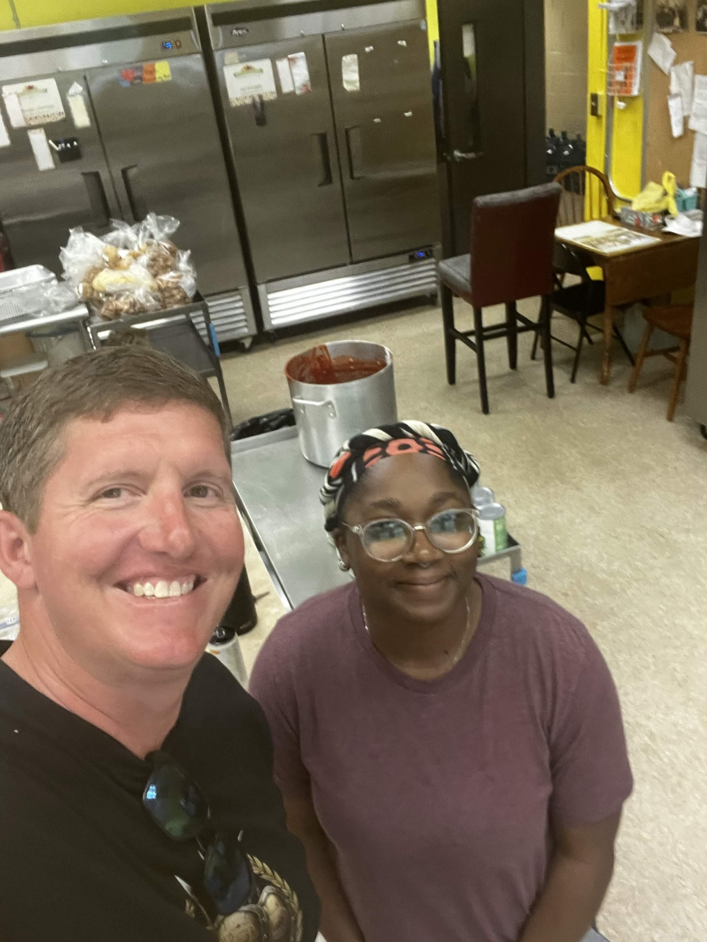 The Veterans Phalanx Founder and Executive Director with a Gracie's Kitchen volunteer inside the kitchen.
